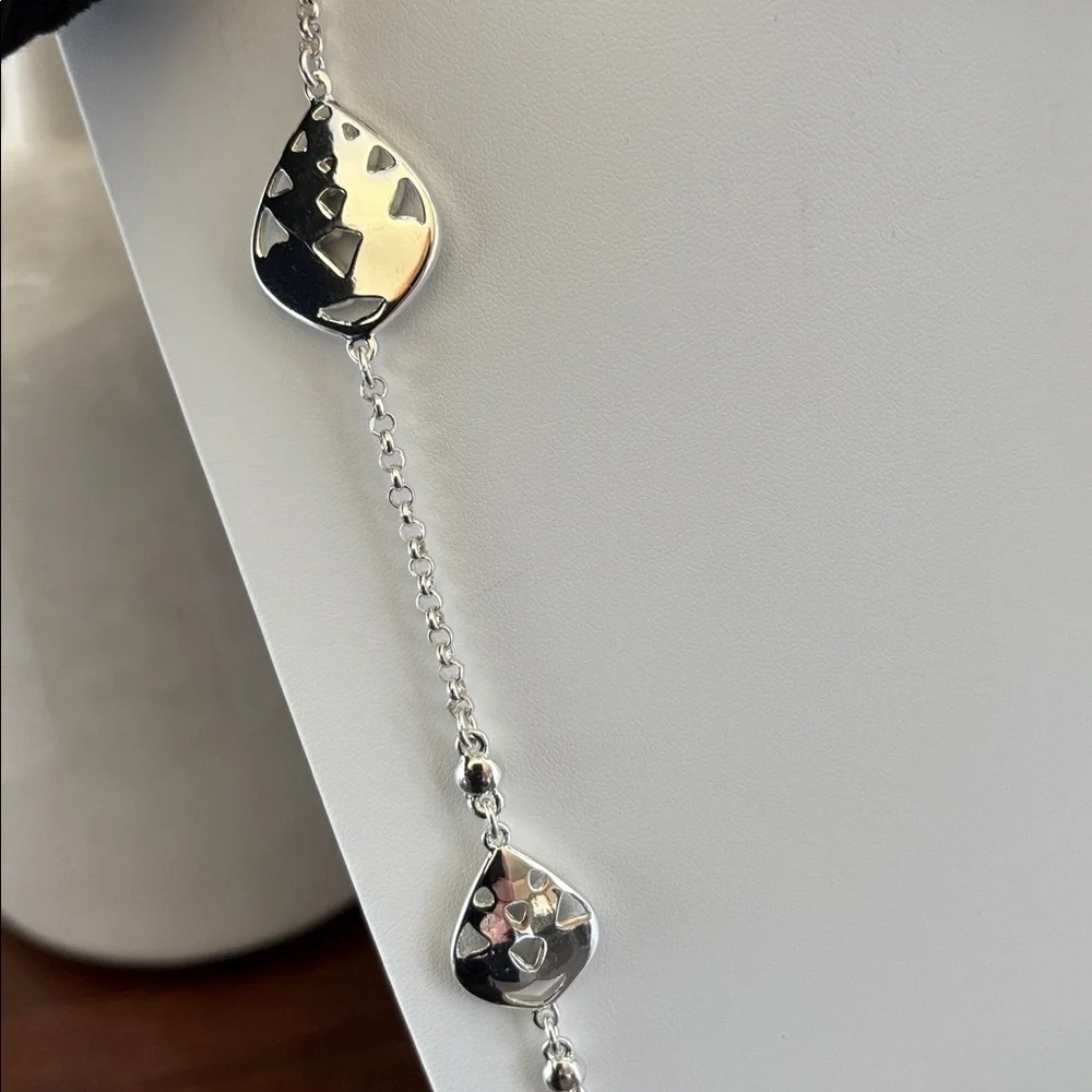Gloria Vanderbilt Reversible Silvertone chain,teardrop w/blue & clear stones